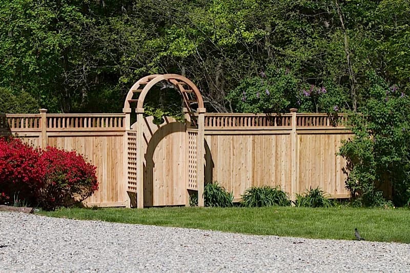 Custom cedar entrance with arbor — built in our Southington workshop